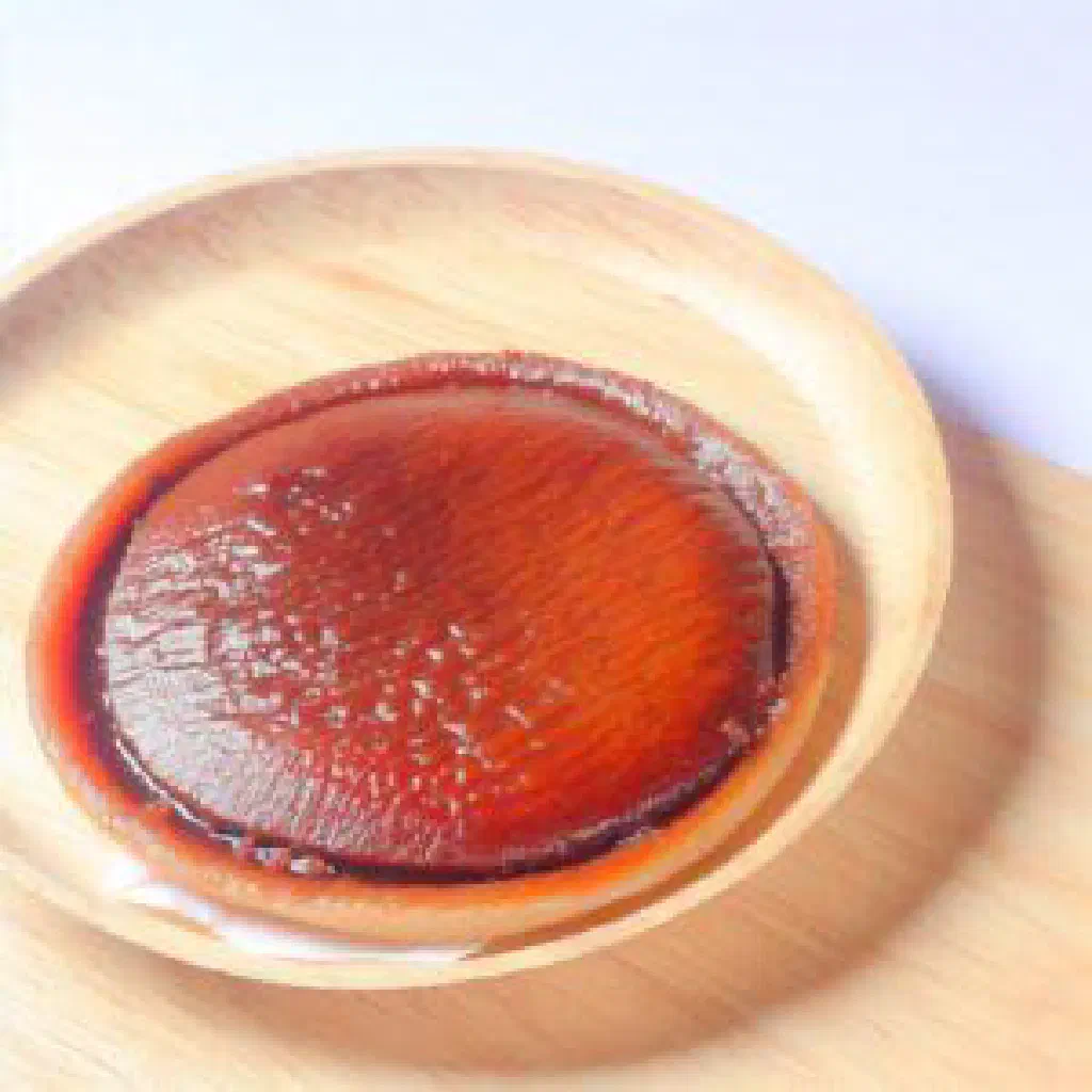 Flat Filipino piaya flatbreads dusted with sesame seeds on a plate