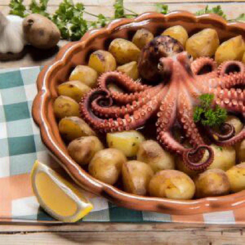 Roasted octopus with crushed potatoes, garlic and olive oil