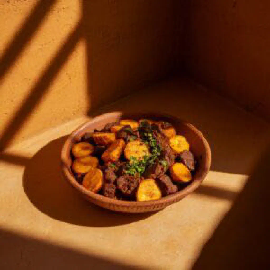 Golden deep-fried Senegalese pastels stacked on a plate