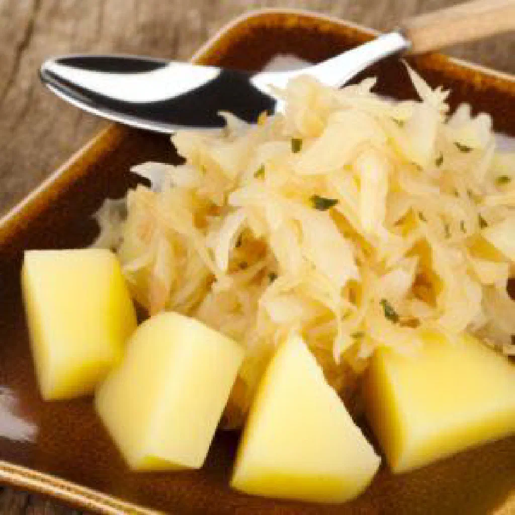 Bowl of Serbian kiselica sauerkraut stew with carrot and paprika