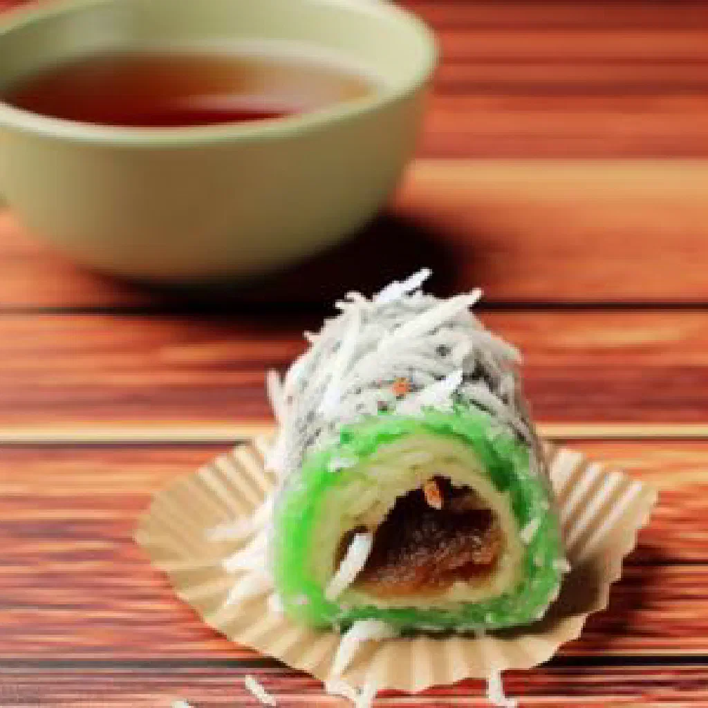 Green pandan pancakes rolled around a sweet coconut filling