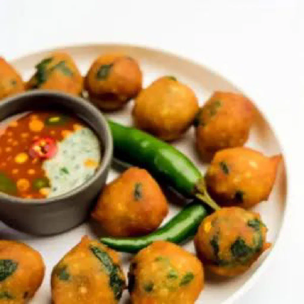Golden deep-fried South African chilli bites served on a plate