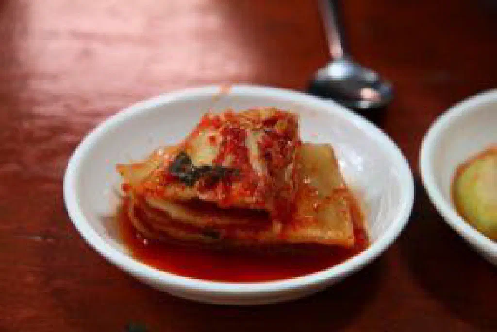Bowl of freshly made red kimchi with napa cabbage