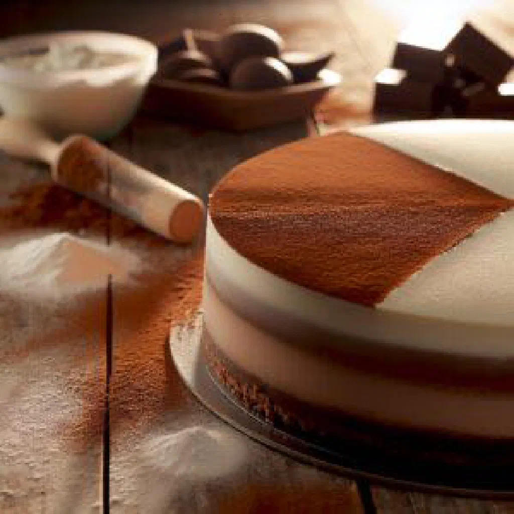 Layered three-chocolate cake with dark, milk and white chocolate stripes