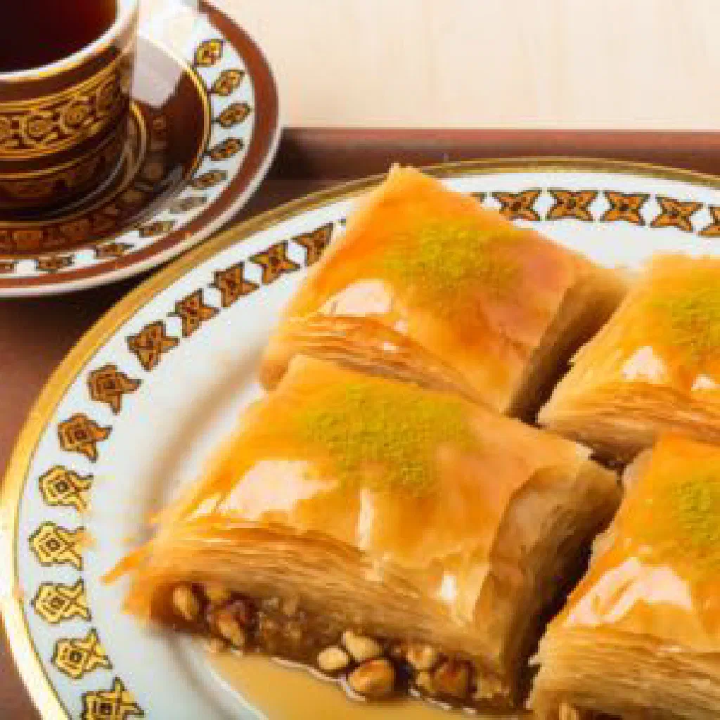 Diamond-cut baklava layered with nuts and glazed with honey syrup