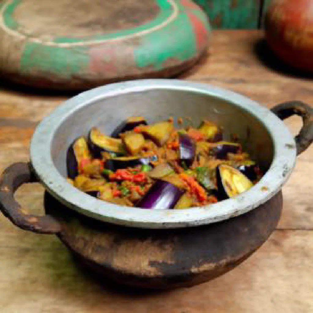 Fried aubergine cubes simmered in creamy coconut milk, garnished with fresh coriander