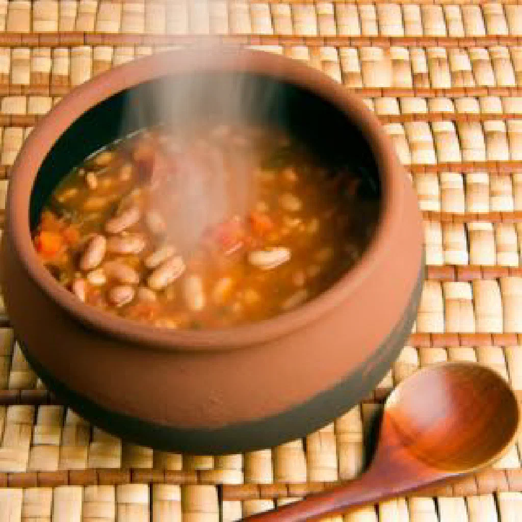 Bowl of Tanzanian beans simmered in coconut milk, garnished with fresh coriander