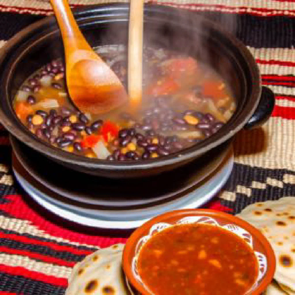 Bowl of Tende za Nazi, tender beans in a golden coconut milk sauce with fresh coriander