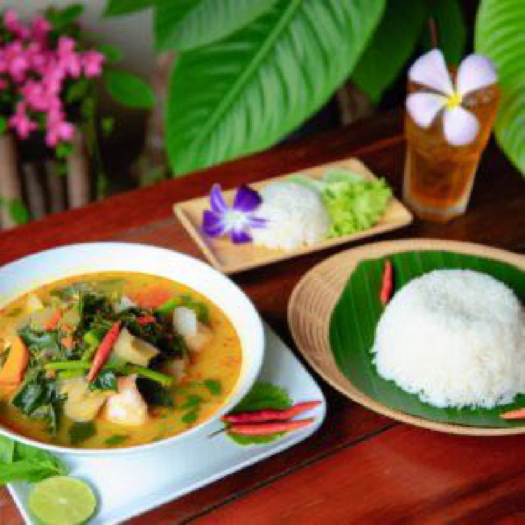 Spicy Thai jungle curry with chicken, peppers and green beans garnished with coriander