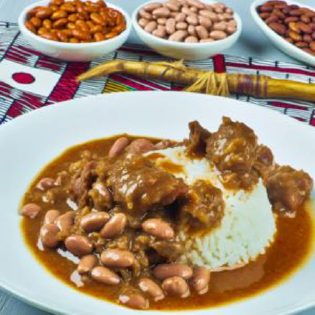 A bowl of smooth Togolese kom served with savoury sides