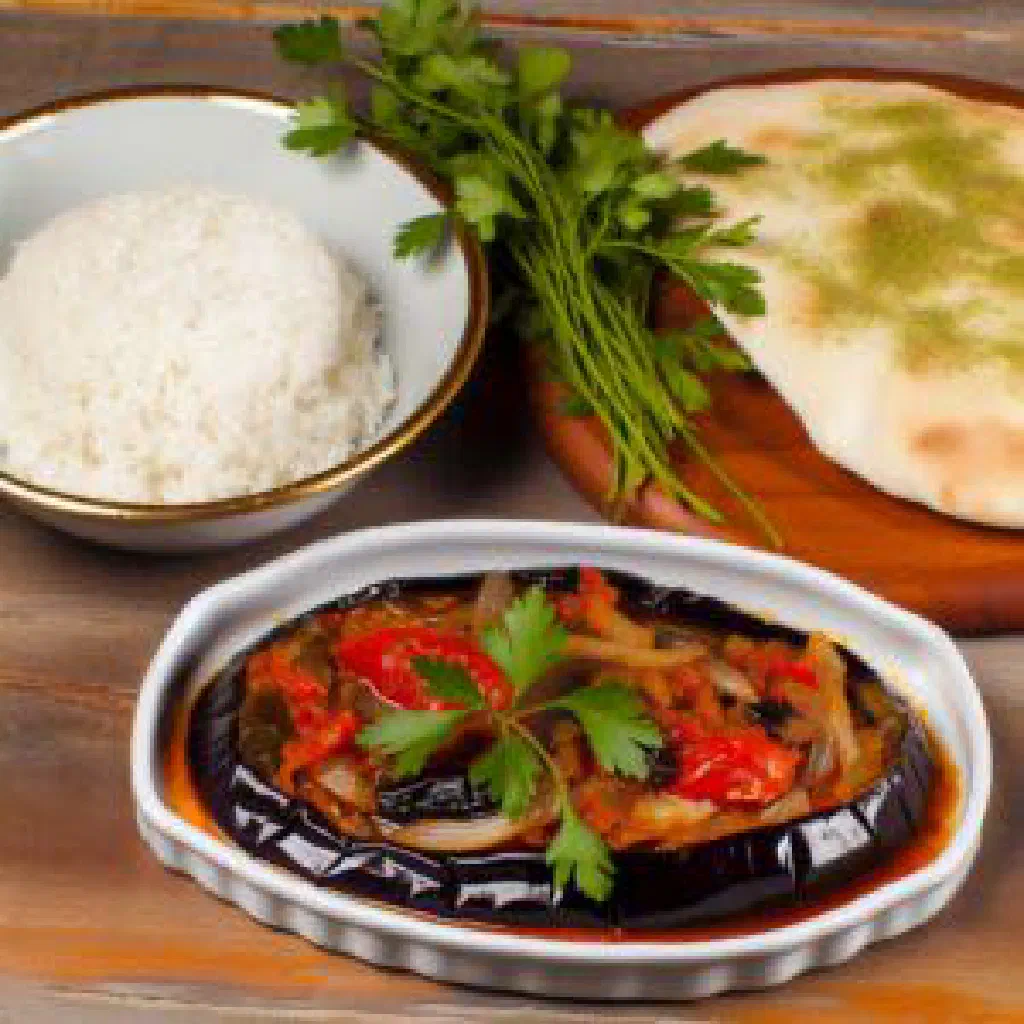 Stuffed aubergines in tomato sauce garnished with parsley
