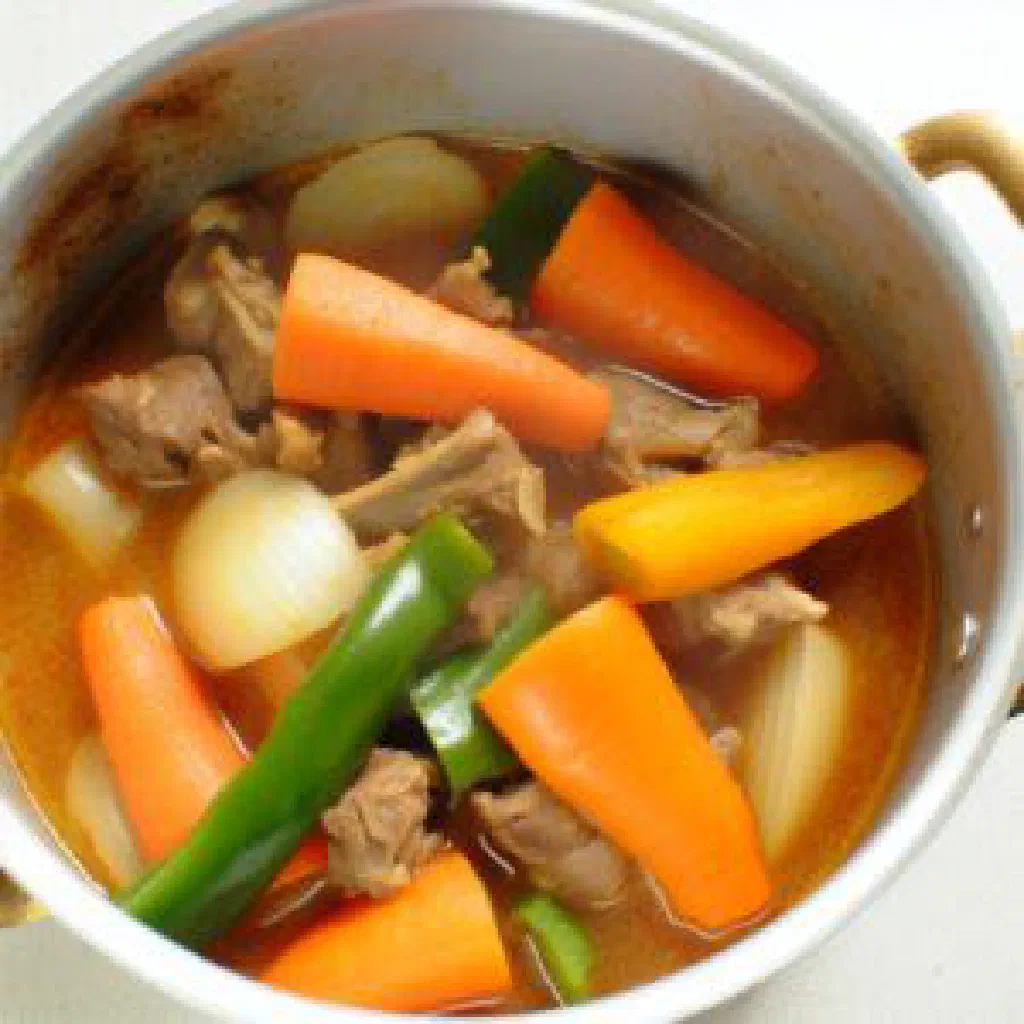 Chyngyz, a spiced Turkmen lamb and vegetable dish garnished with fresh herbs