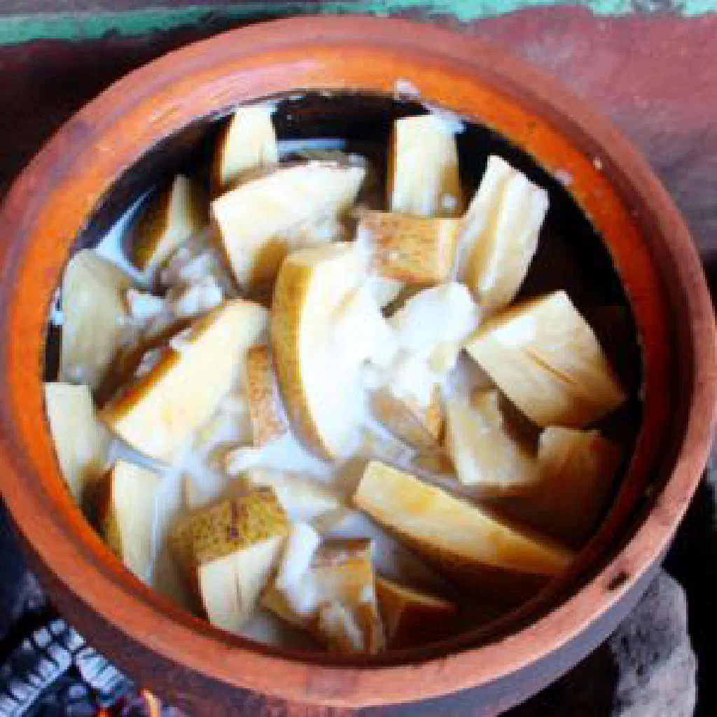 Roasted breadfruit pieces served with fresh coconut