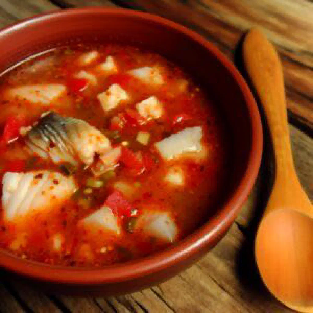 Banga fish simmered in a rich peanut sauce, garnished with fresh coriander